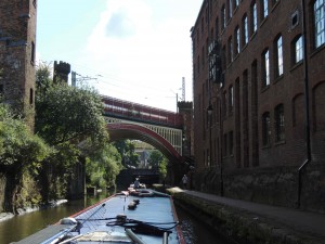 Rochdale Canal through city center. Under, through and beside buildings