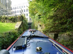 narrow overgrown lock approach on Huddersfiled Narrow Canal