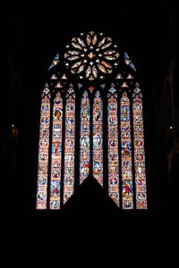 the west window of the cathedral, with the sun behind, making the while thing glow
