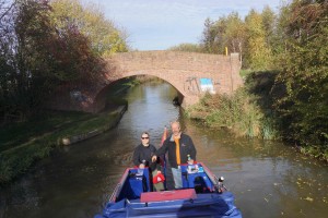 Pat and Kerry revisiting travel under Pat's Bridge- on the Grand Union Canal