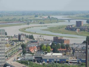 the Neder Rijn in Arnhem, in flood, with the re-built city in the foreground